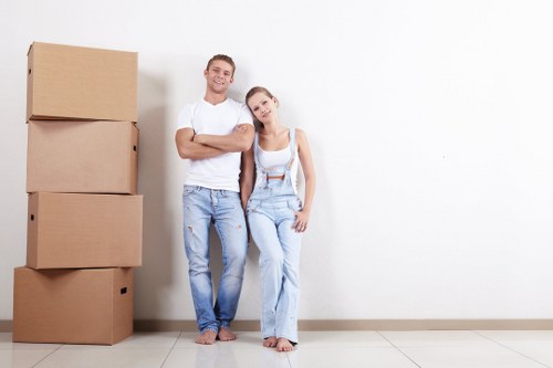 Professional house removals planning in Merton with moving boxes and furniture