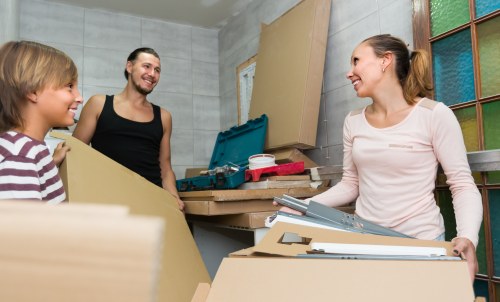 Furniture removals team working in a Merton residential street