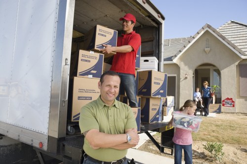 Students moving shared house items with local removals support