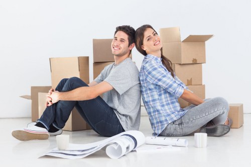Professional movers transporting office furniture in Merton
