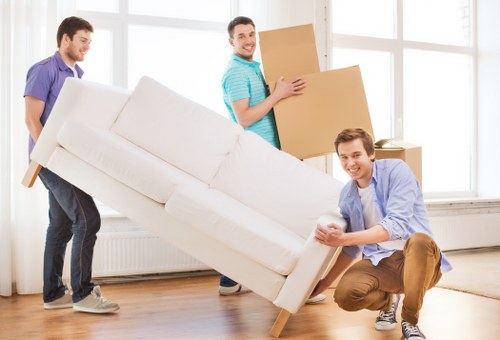 Professional movers loading items for same day removals in Merton