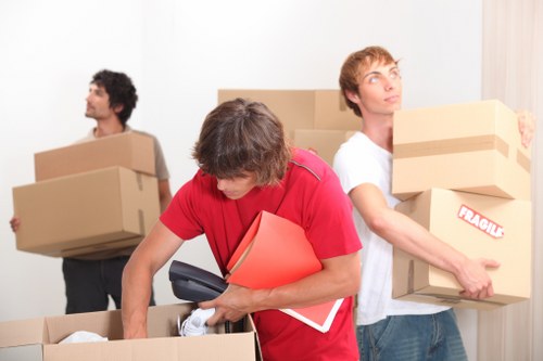 Packing office equipment for a move in Merton