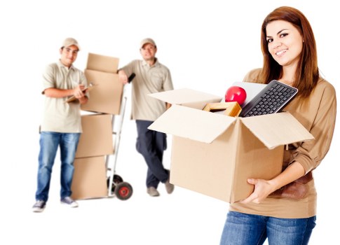 Business relocation items being loaded into a removal van in Merton