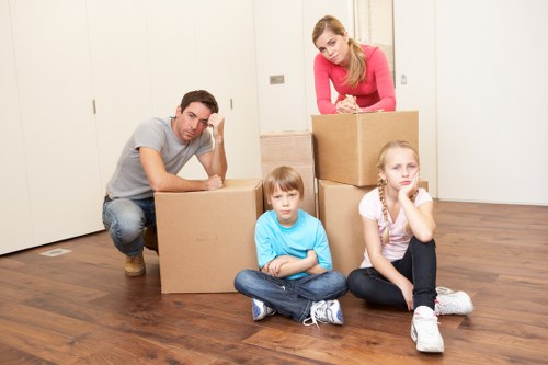 Fragile household items carefully packed in sturdy boxes in Merton