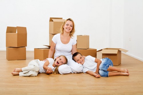 Moving team preparing furniture for transport during a van removal service