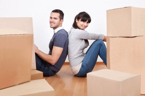 Household move preparation with labeled boxes and furniture