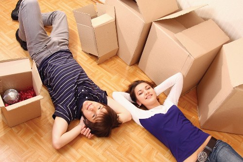 Trained removals staff handling boxes with care