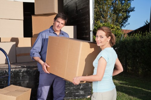 Professional movers handling furniture during a Merton relocation